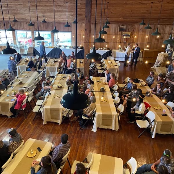 Overhead view of a large gathering at Rendezvous Bar & Grill, with guests seated at long tables.
